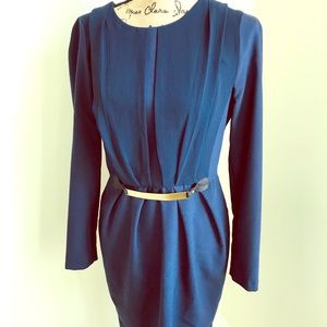 Navy blue long sleeve dress with gold belt accent